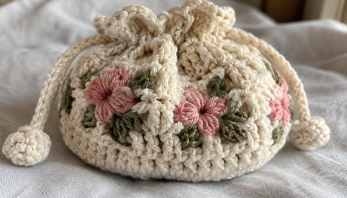 Colorful crochet toys and kids hats arranged as gifts