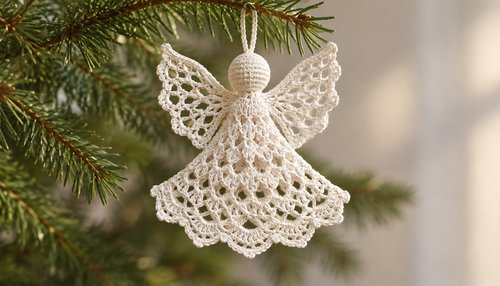 Crochet angel ornament hanging on a Christmas tree