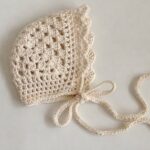 Cream vintage crochet baby bonnet with ties