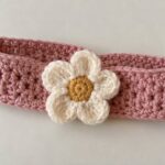 Pink crochet baby headband with white daisy flower