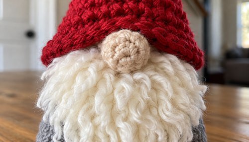 Close-up of fluffy white yarn beard on crochet gnome