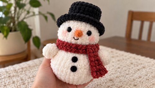 Chunky crochet snowman plush with top hat and scarf