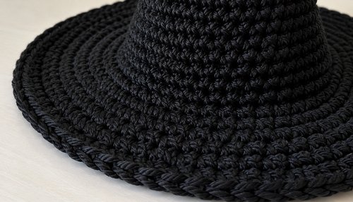Close-up of single crochet stitches on a black witch hat brim