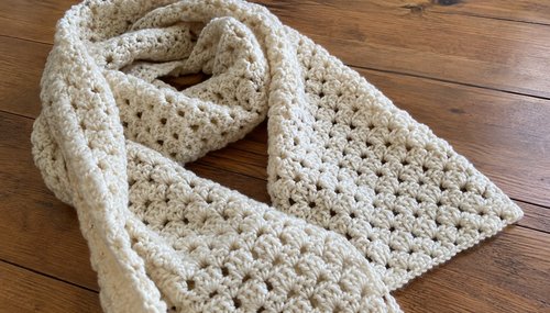 Close-up of the crochet stitches on a handmade winter scarf